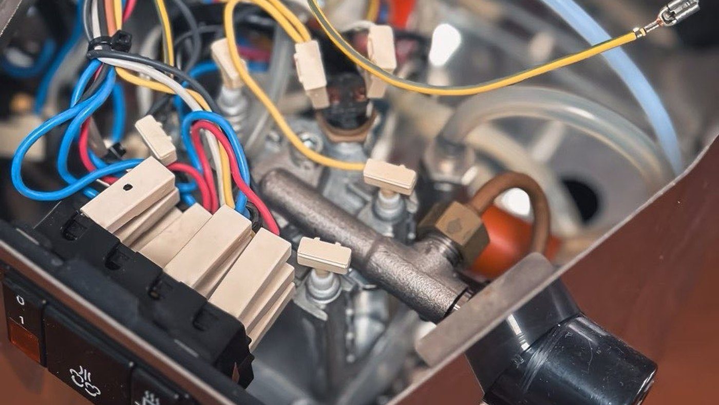 Real internal view of a Gaggia Classic style machine with wiring and boiler area visible