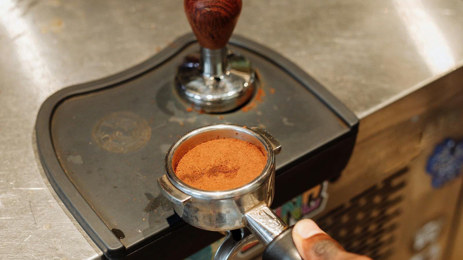 Espresso portafilter and tamper setup used to explain practical Gaggia Classic Pro upgrade order