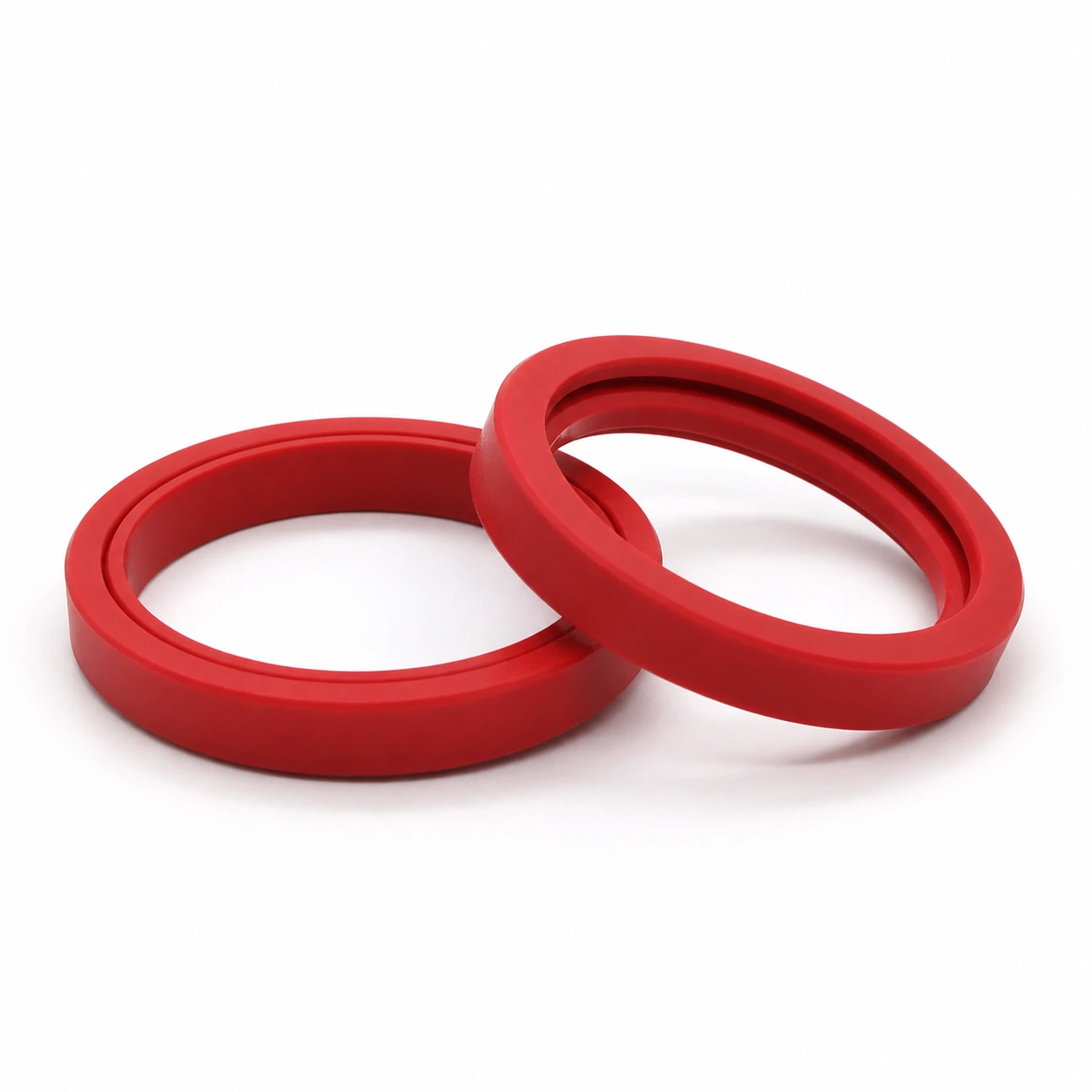 Red silicone E61 group head gasket showing the beveled ring profile