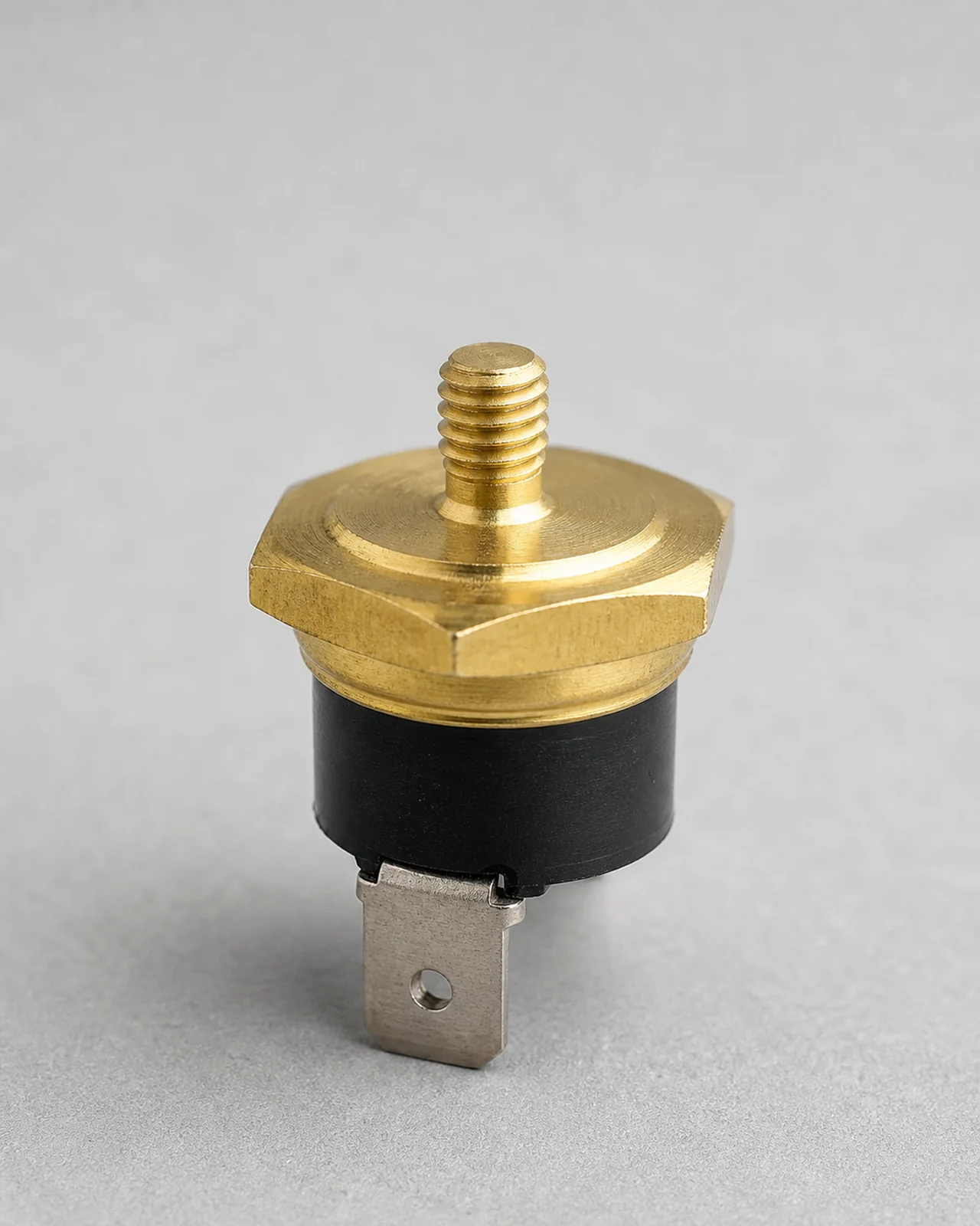 Close view of the M4 brass mounting thread on a Gaggia thermostat