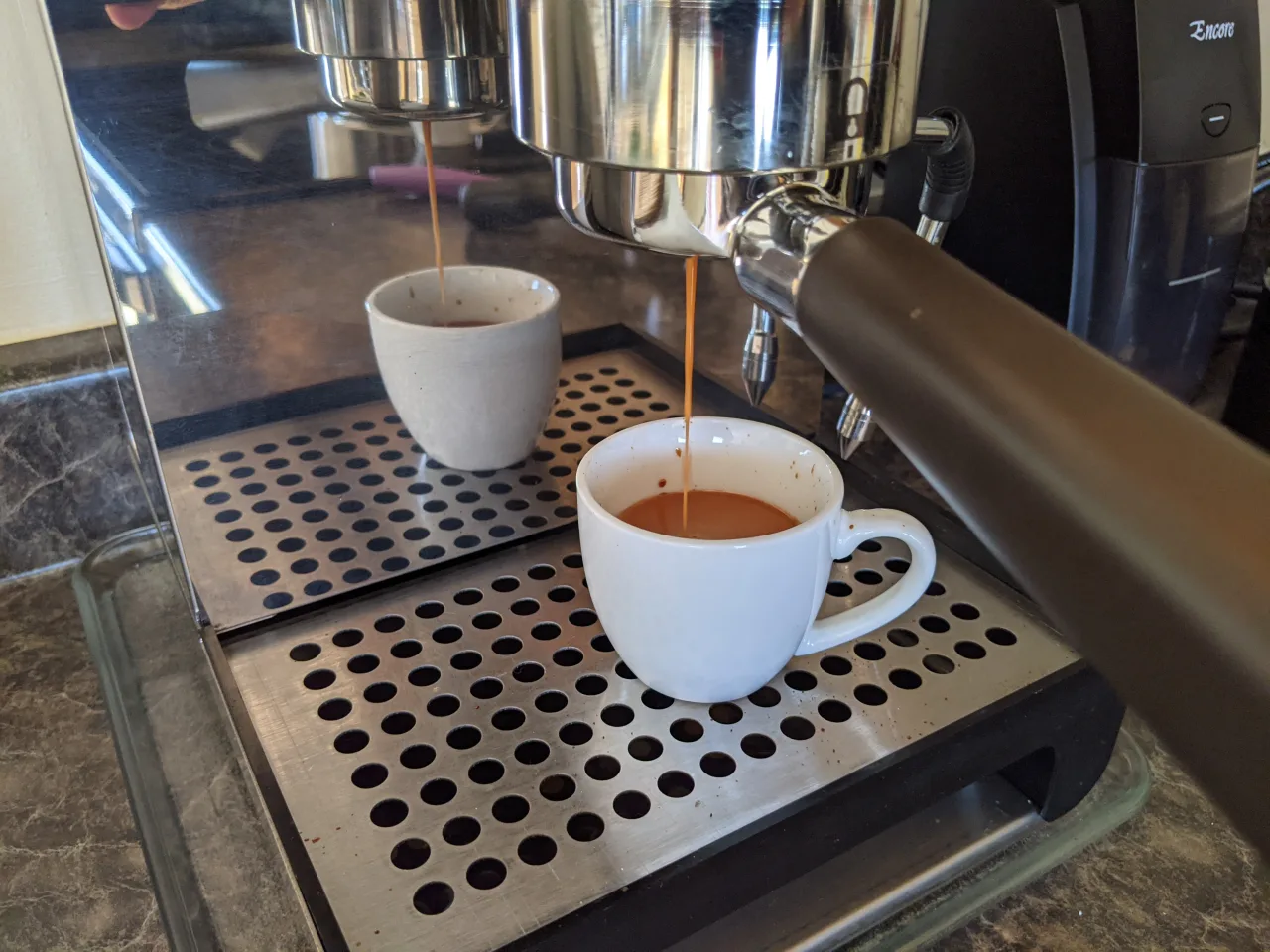 Real espresso extraction from a home machine into two cups