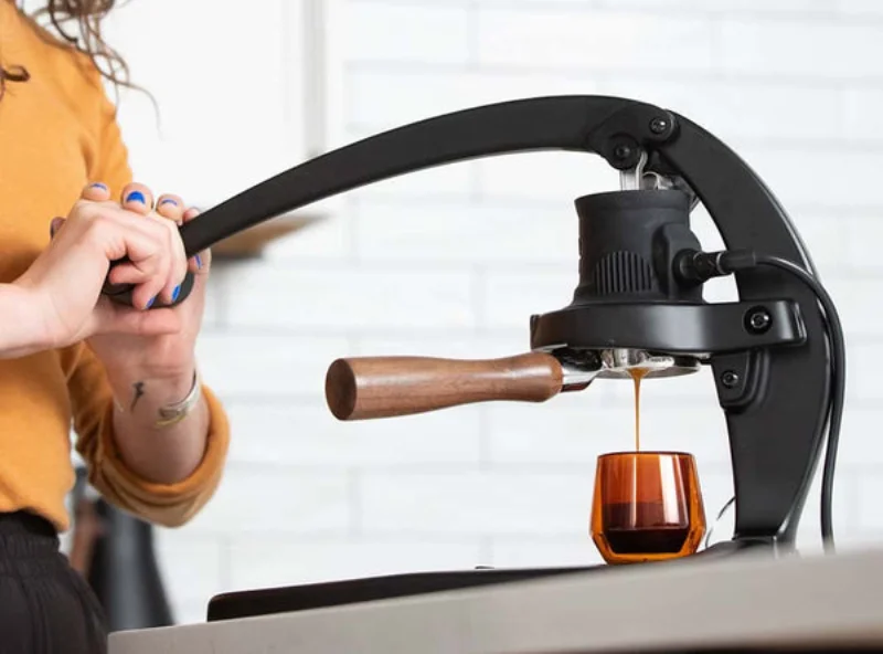 Flair 58 family espresso maker with the lever pressed down
