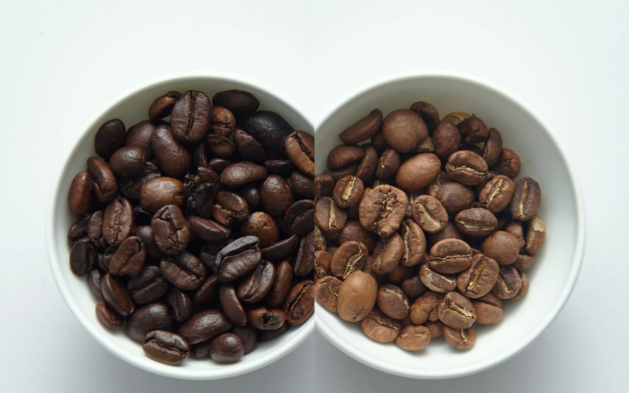 Light, medium and dark roasted coffee beans placed beside one another