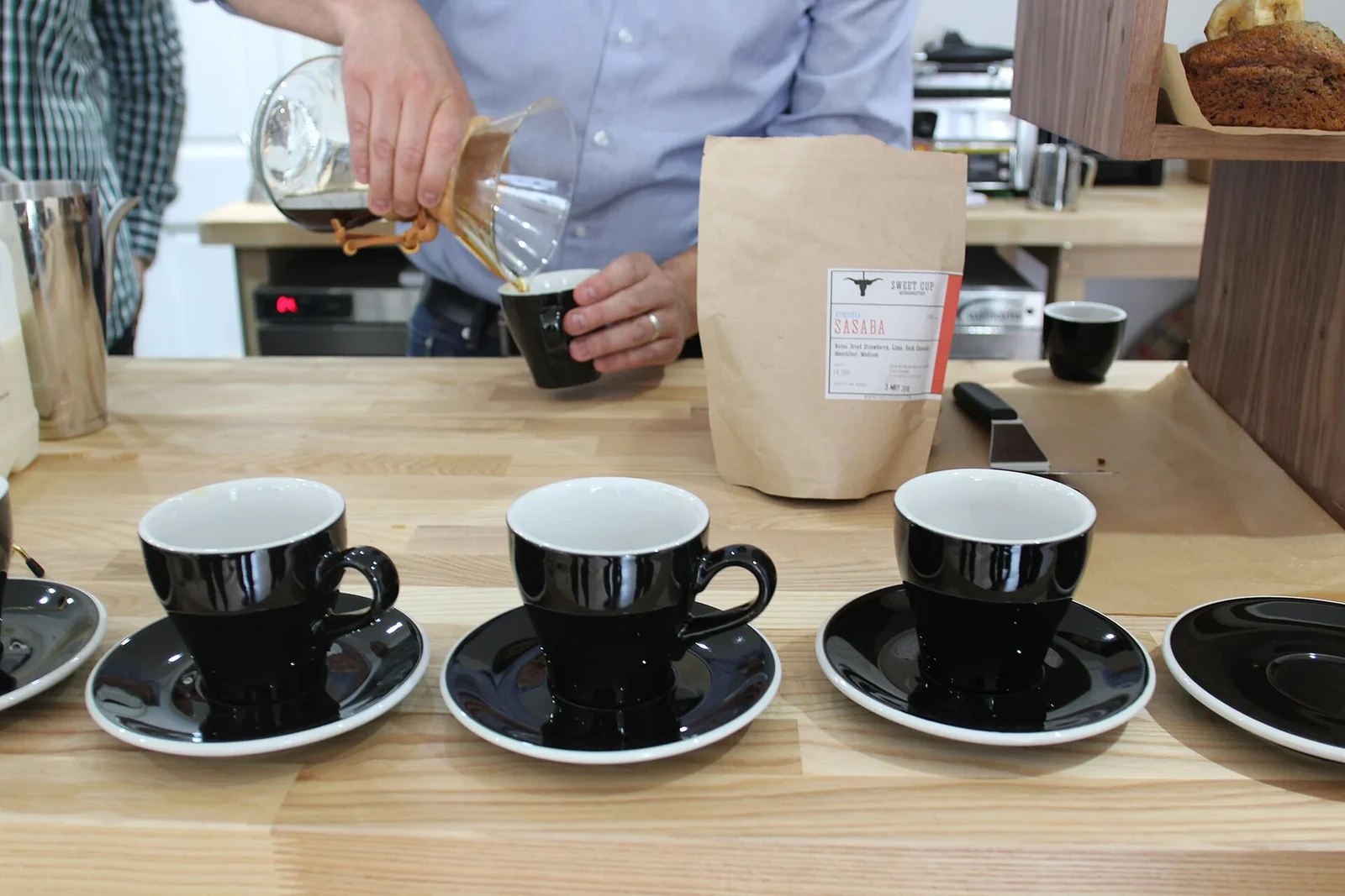 Three black coffee cups prepared together for a side-by-side tasting